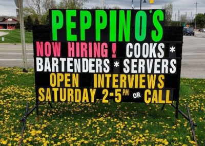 Peppino's Sports Bar in Jenison using a neon lettered black sign to find great new people