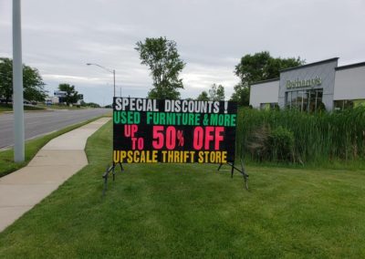 Bethany's Thrift & Consignment Store in Kentwood, Michigan using a Light Bright portable black sign to sell used furniture!