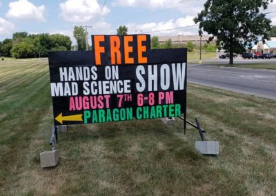 Michigan's leader in black signs in Jackson, MI at the Paragon Charter School advertising a free science event