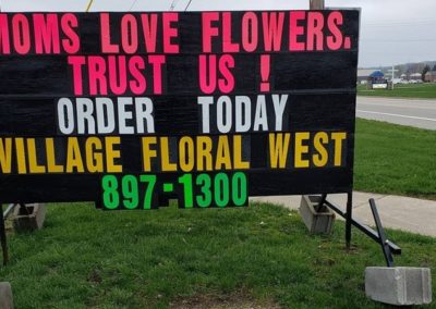 Village Floral in Lowell and Michigan black sign leader Light Bright Signs