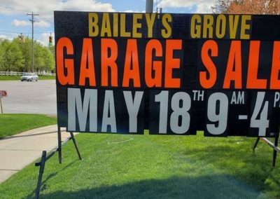 Bailey's Grove in Kentwood, Michigan promoting garage sales with neon lettered signs